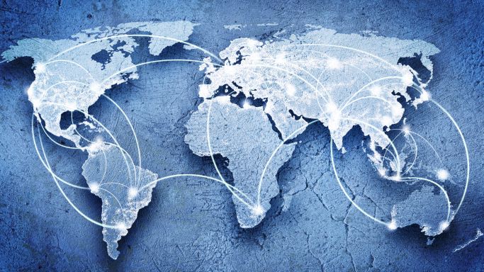 Die Grafik stellt eine Weltkarte dar, auf der die internationale Vernetzung durch Verbindungslinien visualisiert wird